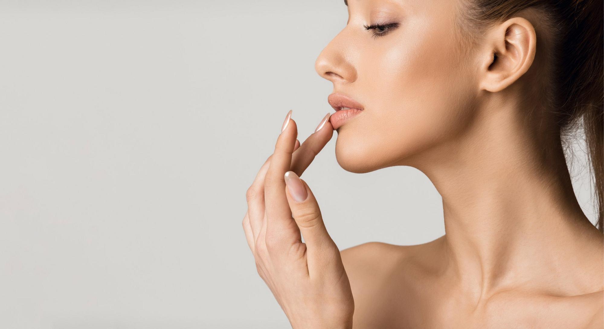 Skin Resurfacing client touching her lip